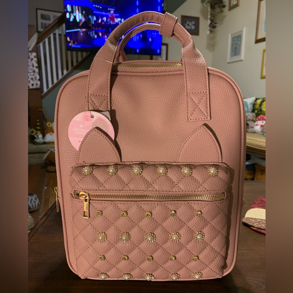 Adorable or pink quilted backpack with cat ears 🐱. NWT!